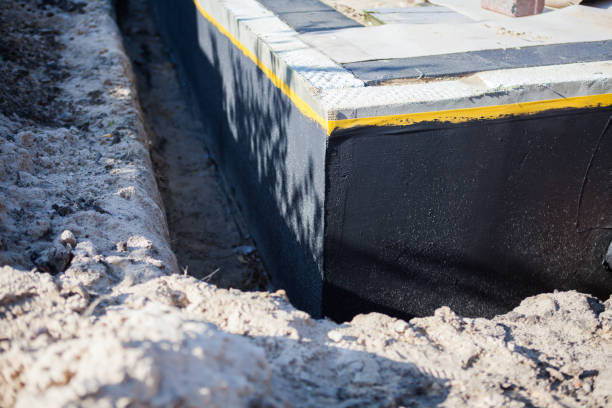 Professional Waterproofing technician working in Broadway, OH